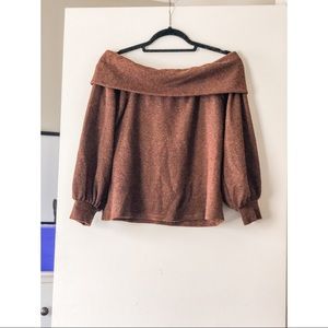 Bronze off the shoulder sweater.
